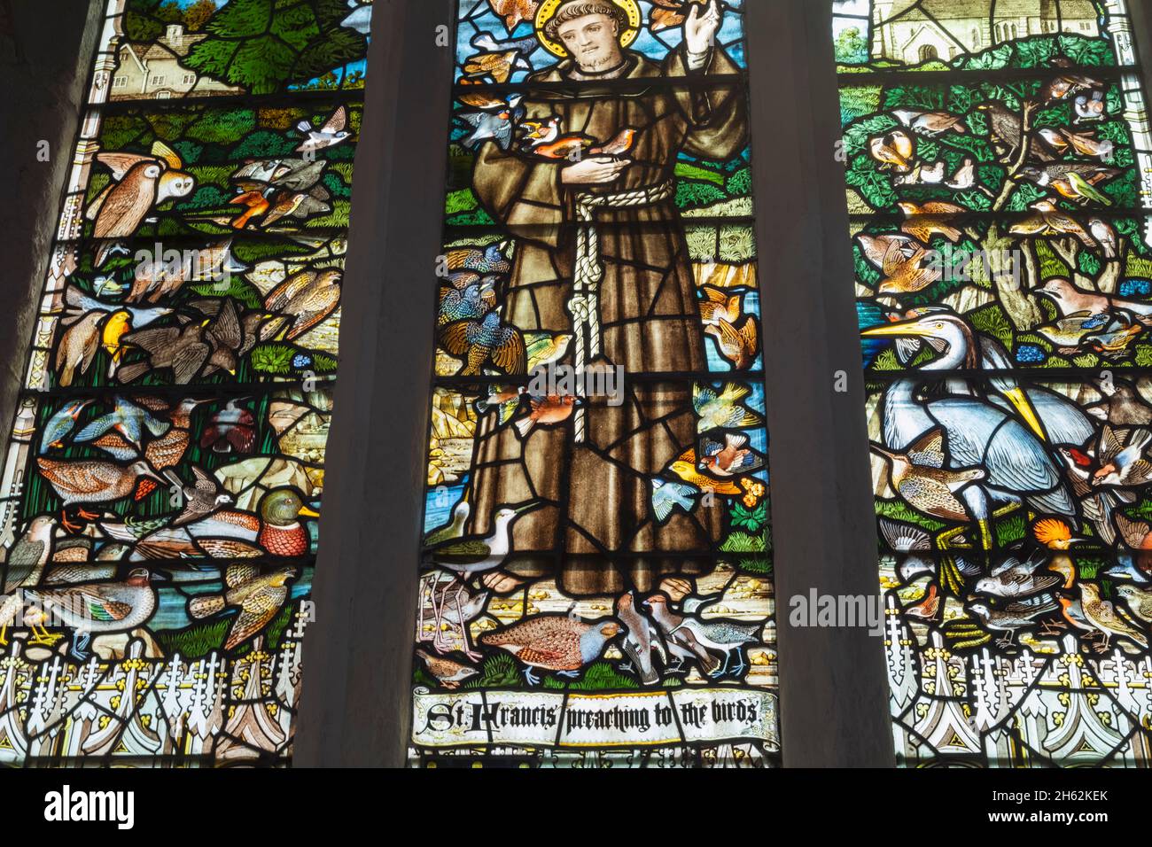 england,hampshire,selborne,st.mary's church,memorial stained glass window to the naturalist gilbert white showing st.francis of assisi feeding the birds Stock Photo