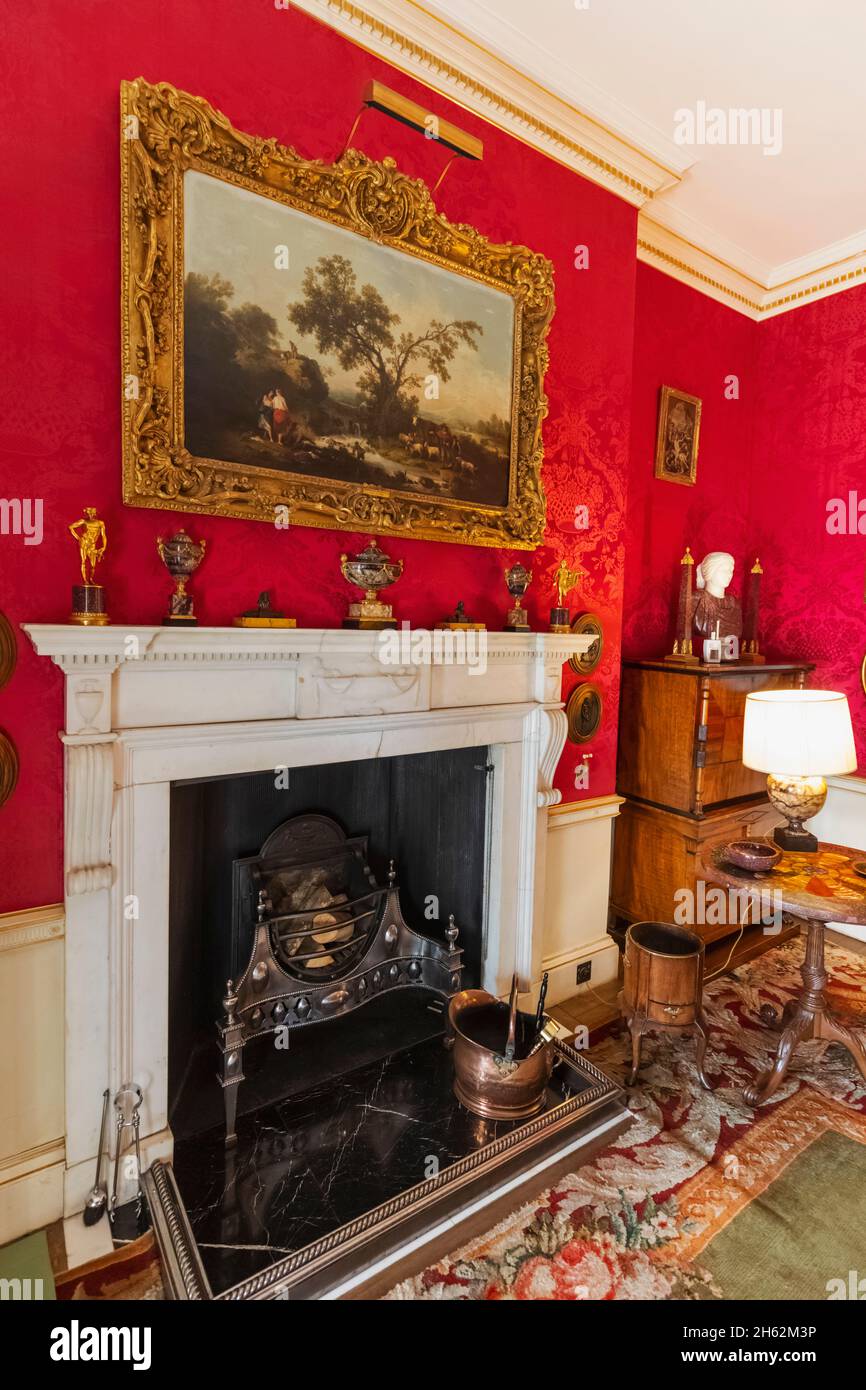 england,hampshire,hinton ampner house,fireplace in the study Stock Photo