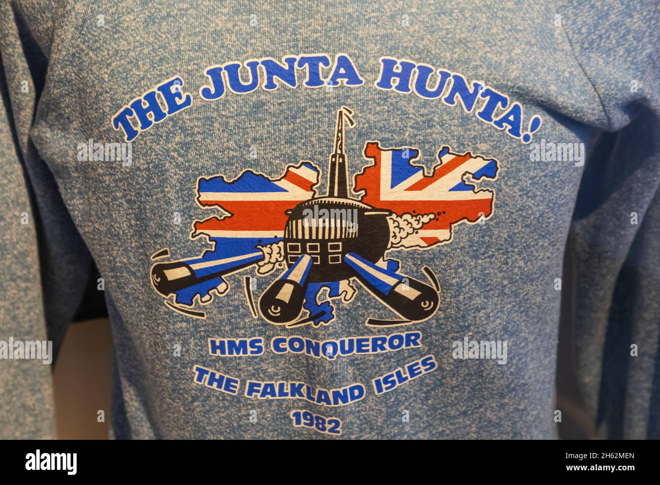 england,hampshire,portsmouth,gosport,portsmouth historic dockyard,submarine museum,souvenir junta hunta jumper from hms conqueror designed during the falkands war with argentina in 1982 Stock Photo