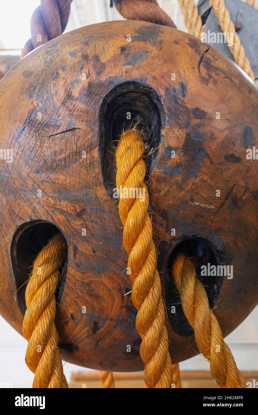 england,hampshire,portsmouth,portsmouth historic dockyard,detail of historic wooden rope pulley block and tackle Stock Photo