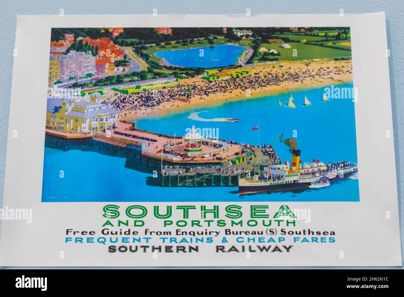 england,hampshire,portsmouth,southsea,vintage railway poster advertising services to portsmouth and southsea showing southsea beach and pier Stock Photo