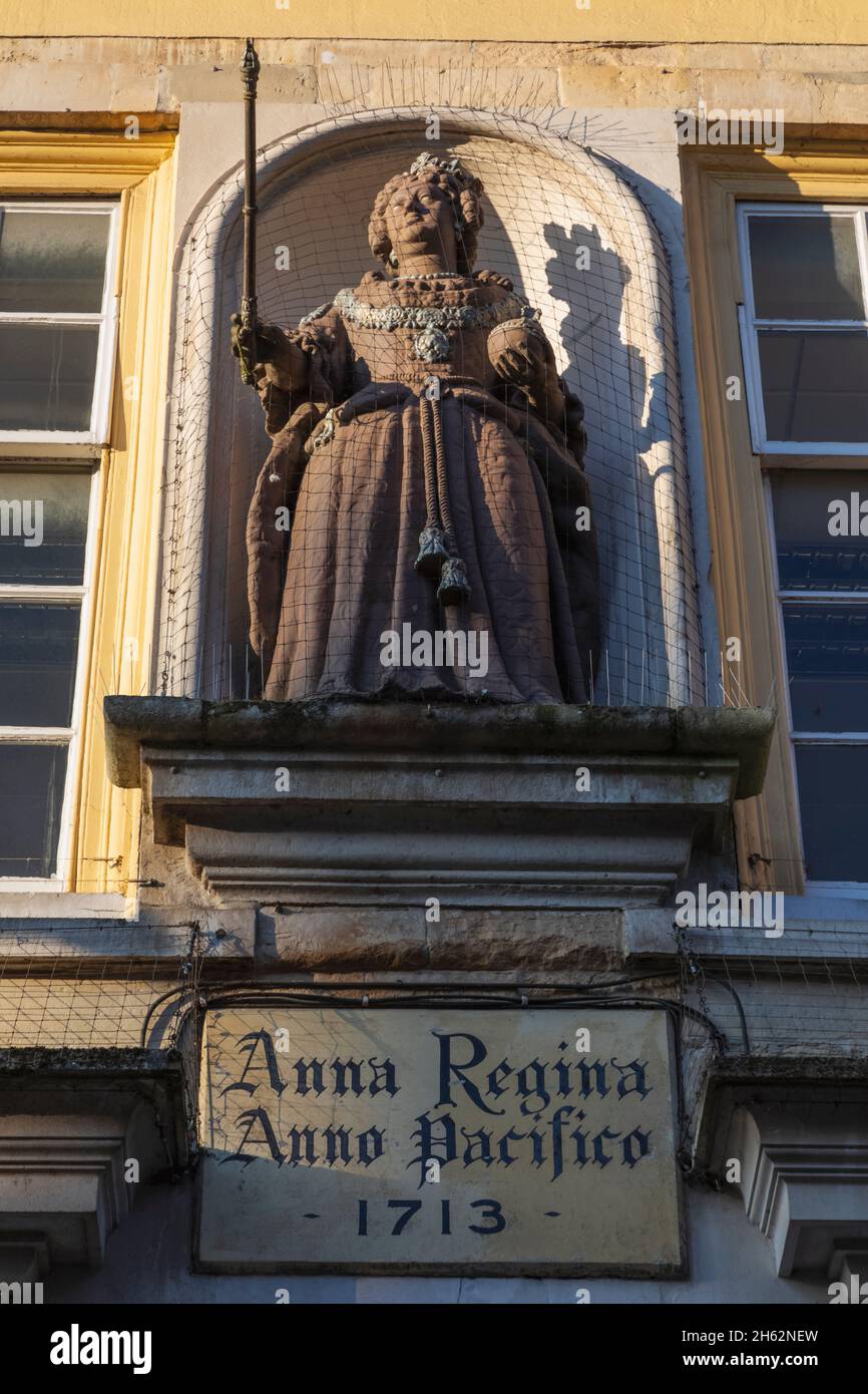 england,hampshire,winchester,the high street,statue of queen anne on the facade of the old guildhall dated 1713 Stock Photo