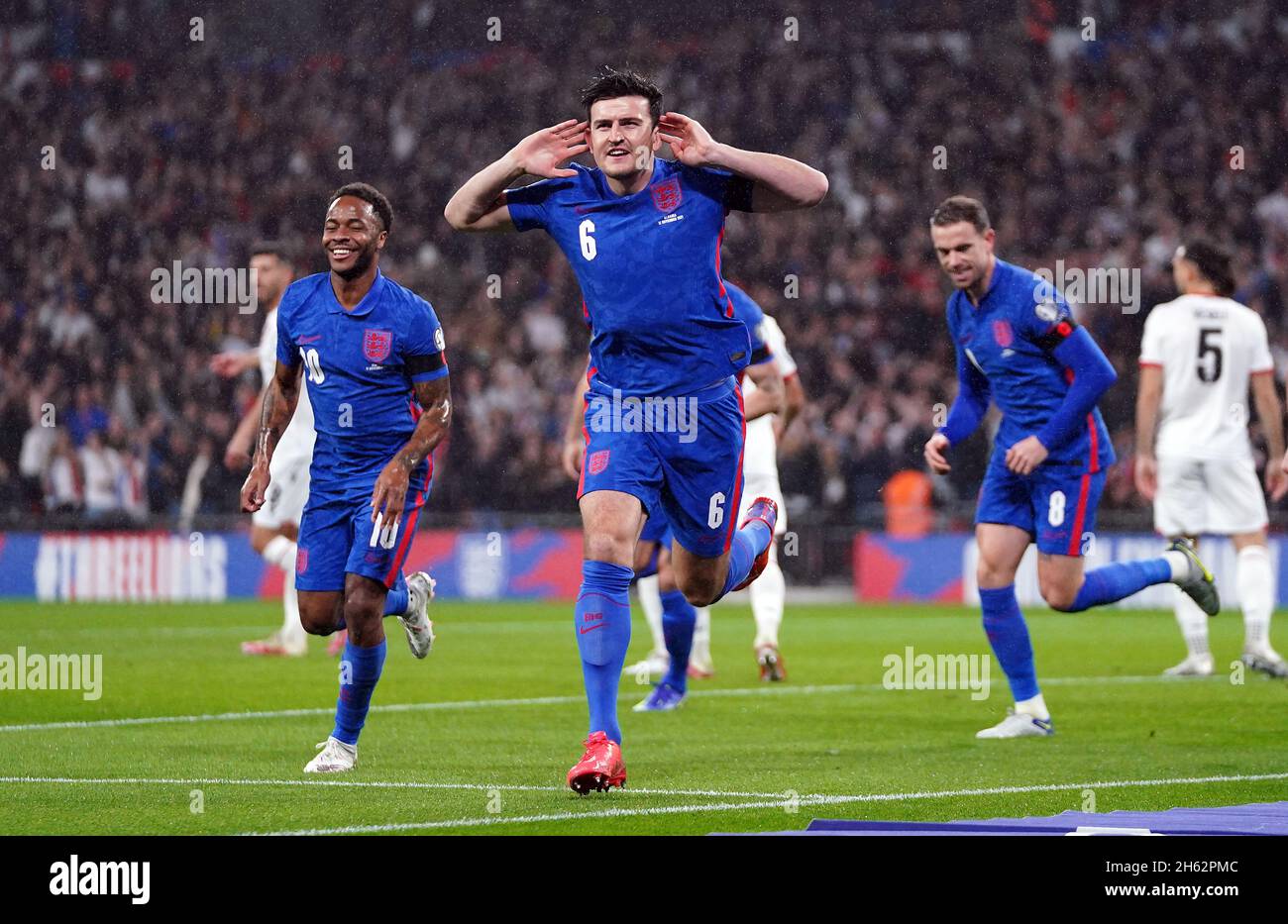 England's Harry Maguire celebrates scoring their side's first goal of the game during the FIFA World Cup Qualifying match at Wembley Stadium, London. Picture date: Friday November 12, 2021. Stock Photo