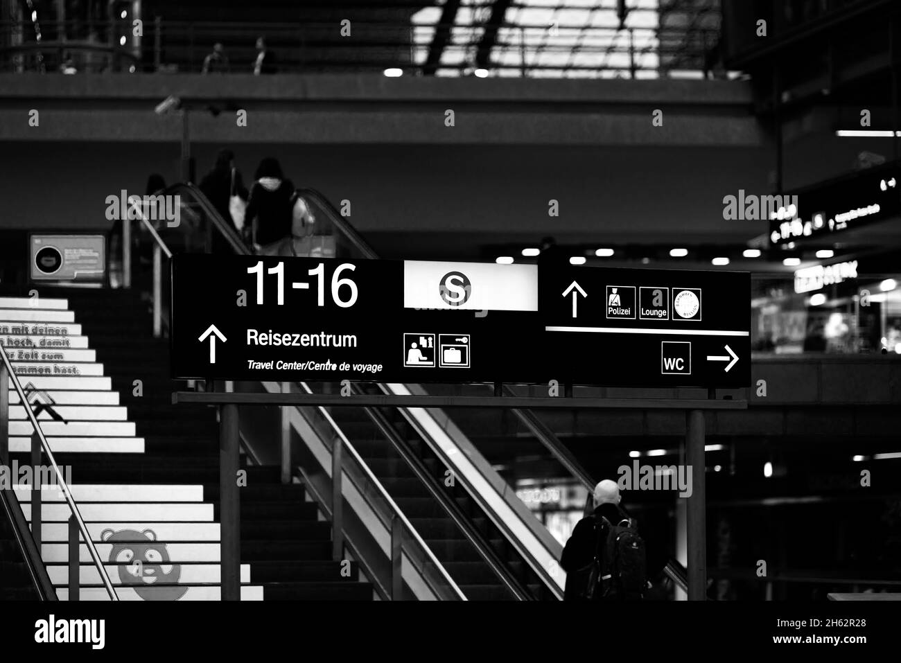 berlin,germany,central station,information board,people on escalator,shallow depth of field,soft bokeh Stock Photo