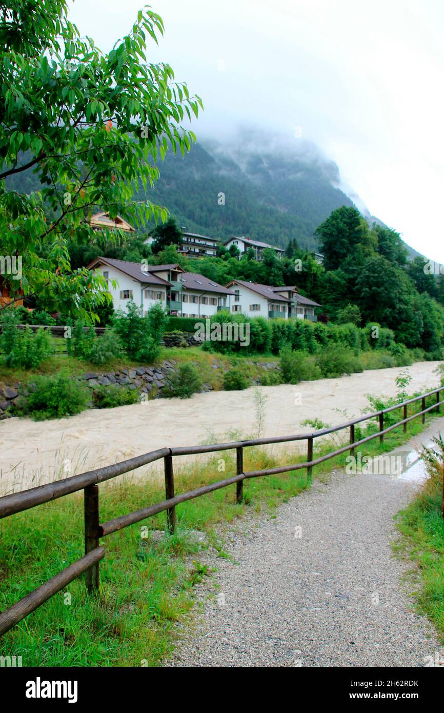 isar near mittenwald,flood,environment,environmental damage,europe,germany,bavaria,upper bavaria,werdenfelser land,summer,forest,river,isar,river course,07/18/2021,fence,demarcation,way Stock Photo