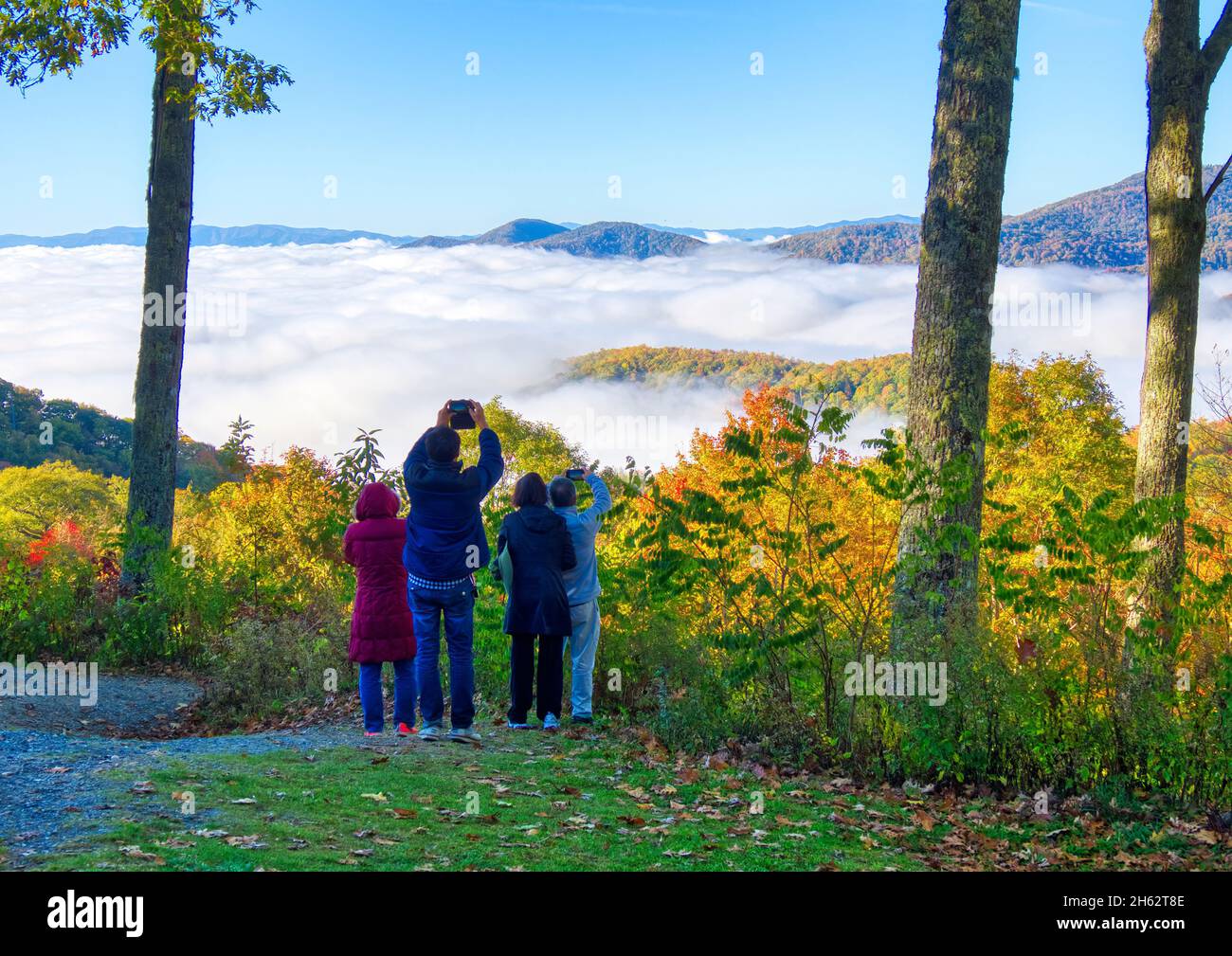 Peopletaking pictures with clouds in the valley from Newfound Gap Road in the Great Smoky Mountains National Park in North Carolina Stock Photo