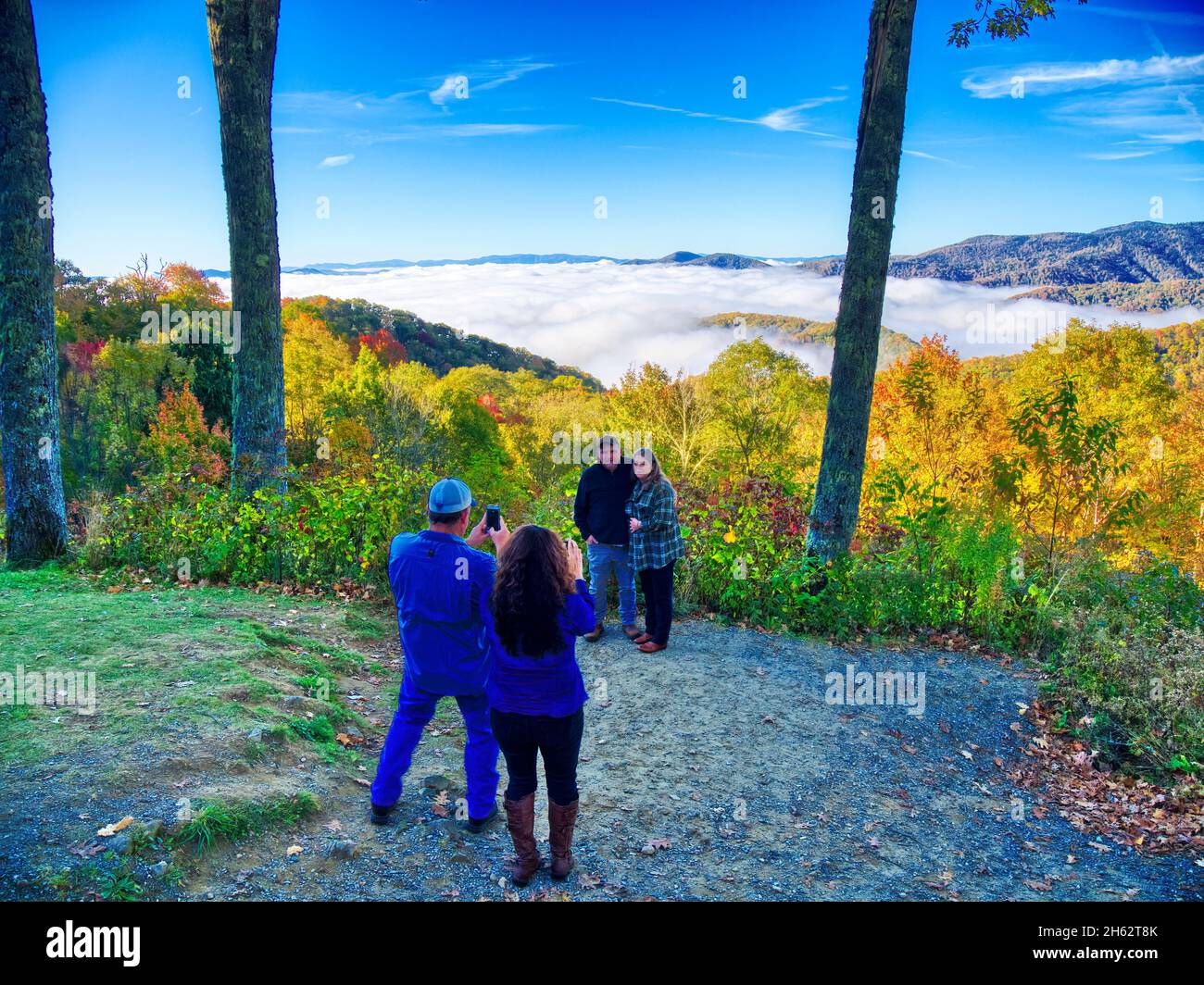Peopletaking pictures with clouds in the valley from Newfound Gap Road in the Great Smoky Mountains National Park in North Carolina Stock Photo