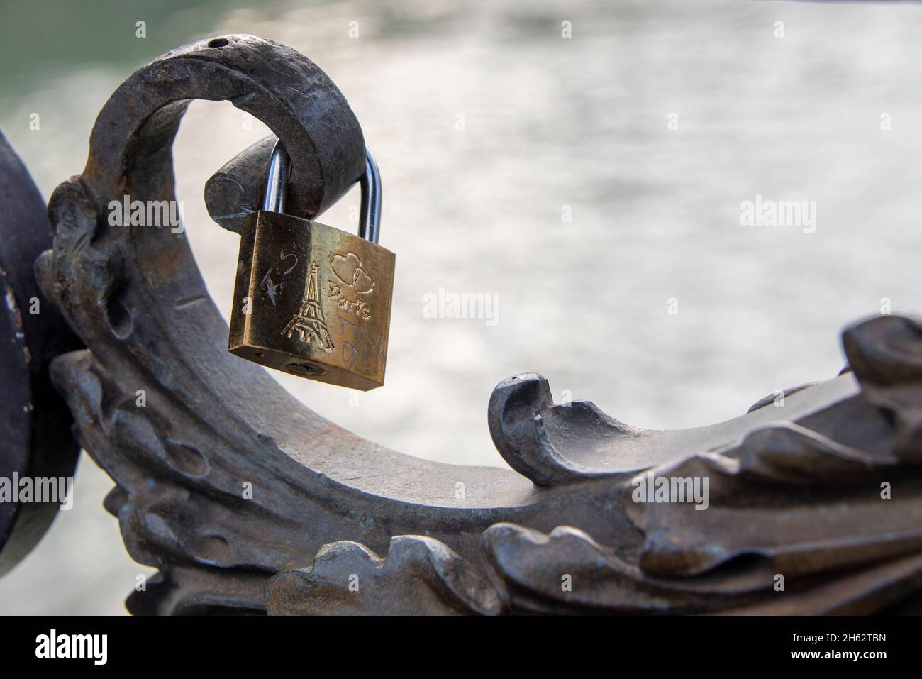 france,paris,a love lock with the eiffel tower hangs on the historic