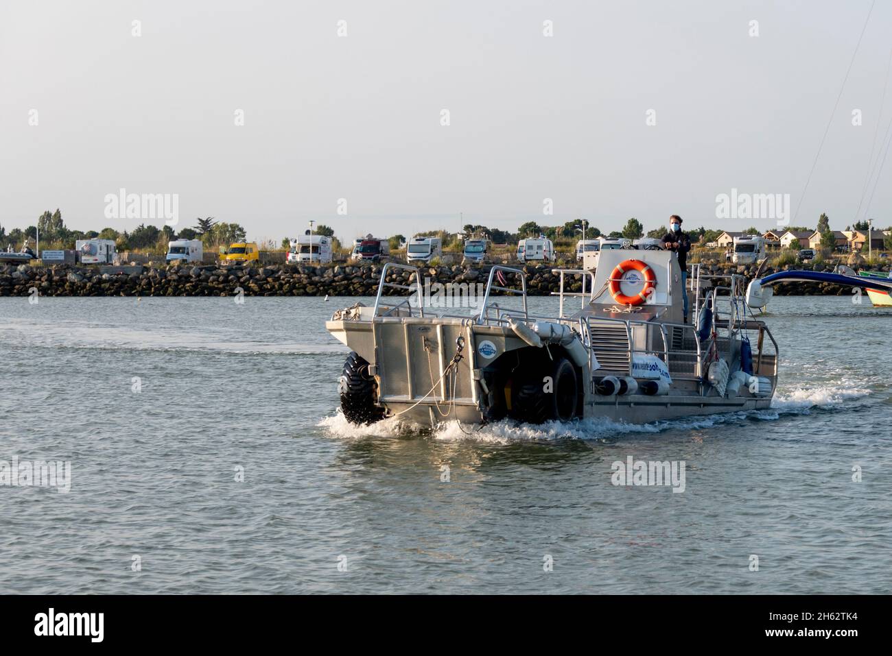france,nouvelle-aquitaine,gironde department,le verdon-sur-mer,an amphibious vehicle in the estuary of the gironde river. it brings tourists to the cordouan lighthouse at low tide,which has been a unesco world heritage site since summer 2021 Stock Photo