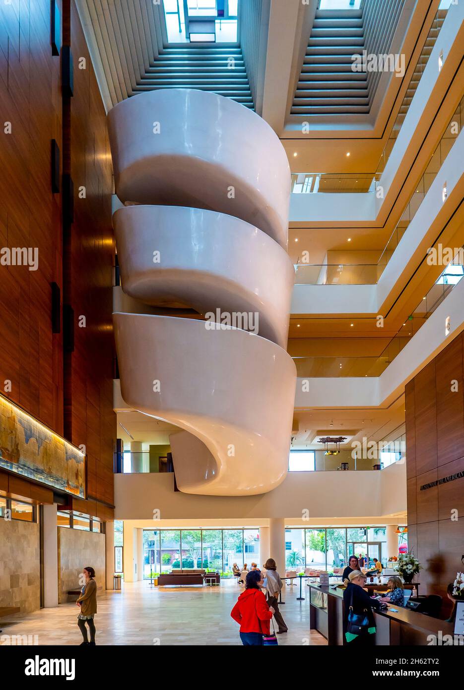 The grand atrium with skylights, and a dramatic spiral staircase in the The Museum of American Arts & Crafts Movement in St Petersburg Florida USA Stock Photo