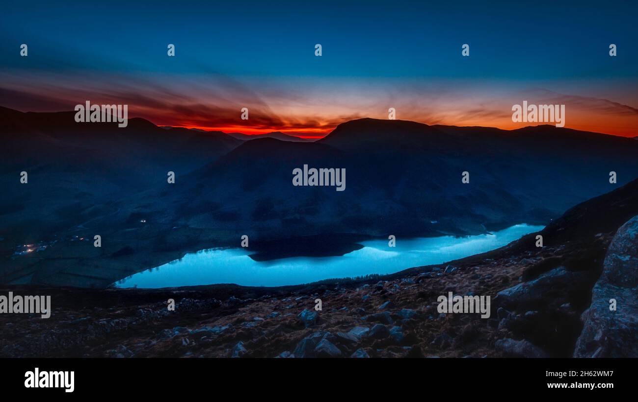 First light over Buttermere lake in English Lake District.Moody mountain landscape scenery at dawn.View from high up. Stock Photo