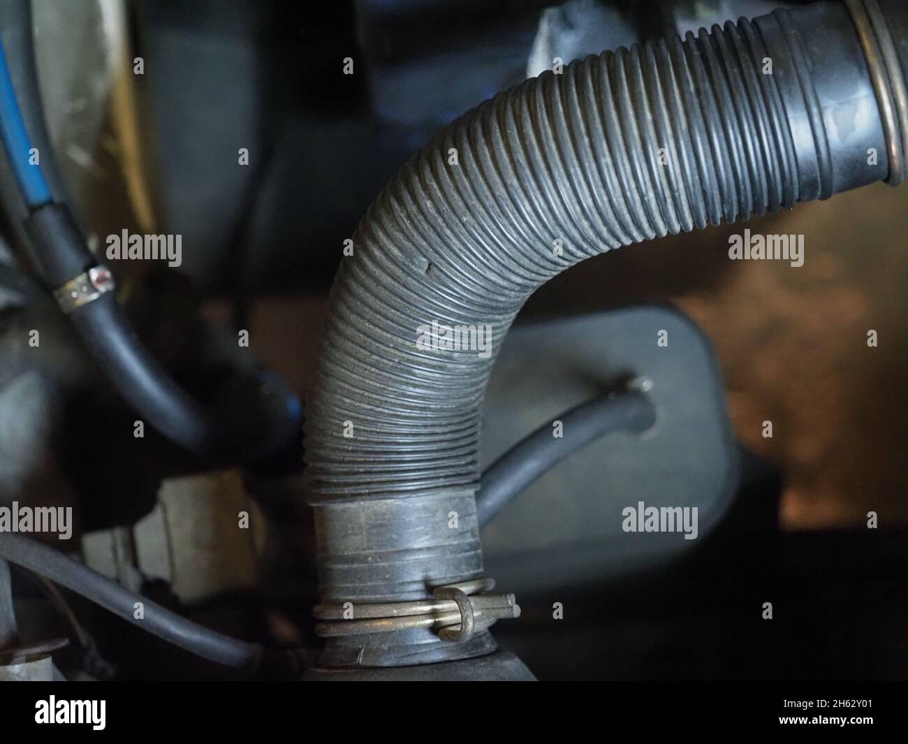 detail of car engine pipes and parts useful as an industrial background