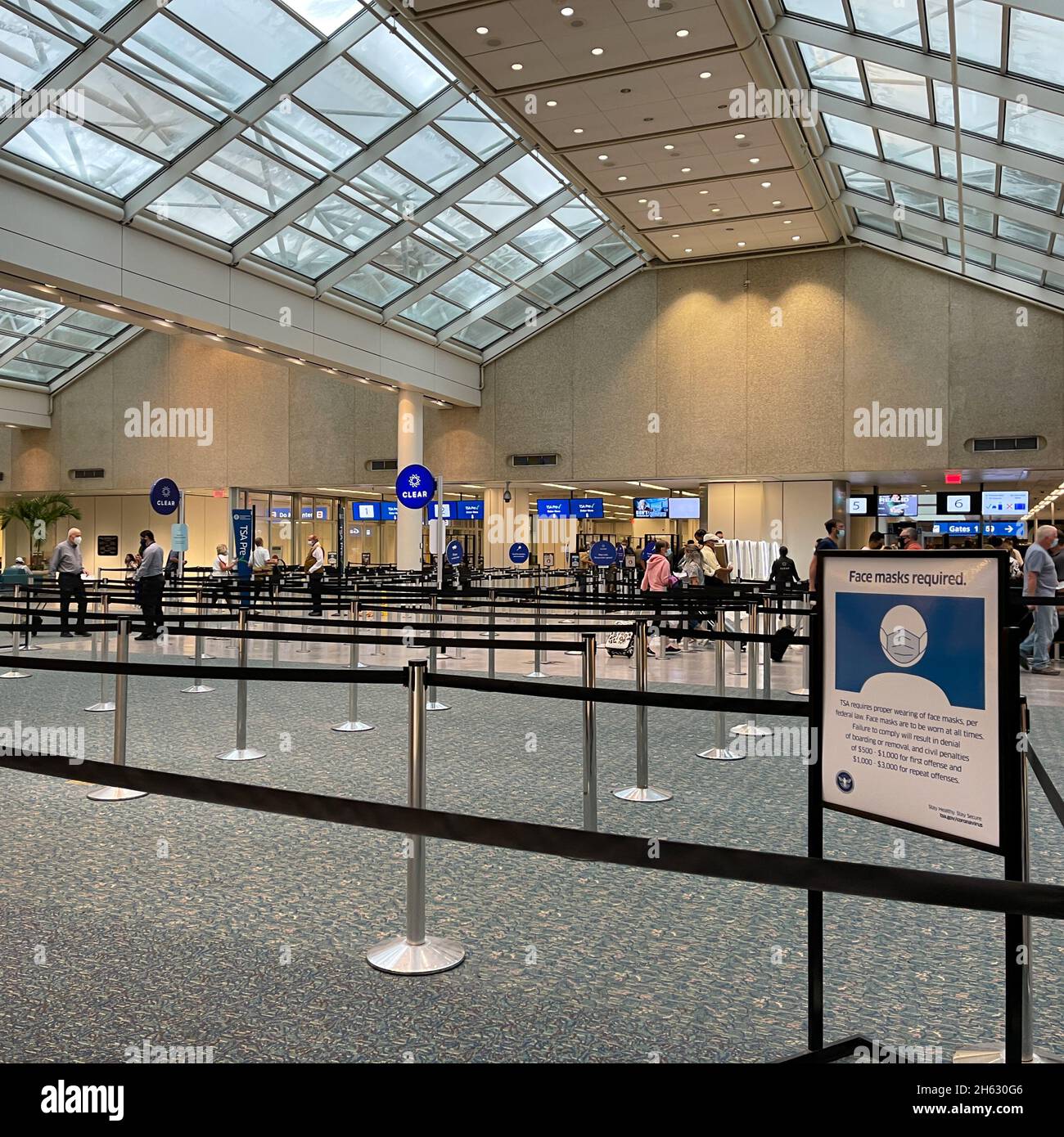 Orlando, FL USA - September 23, 2021:  People walking through the security line at Orlando International Airport MCO. Stock Photo