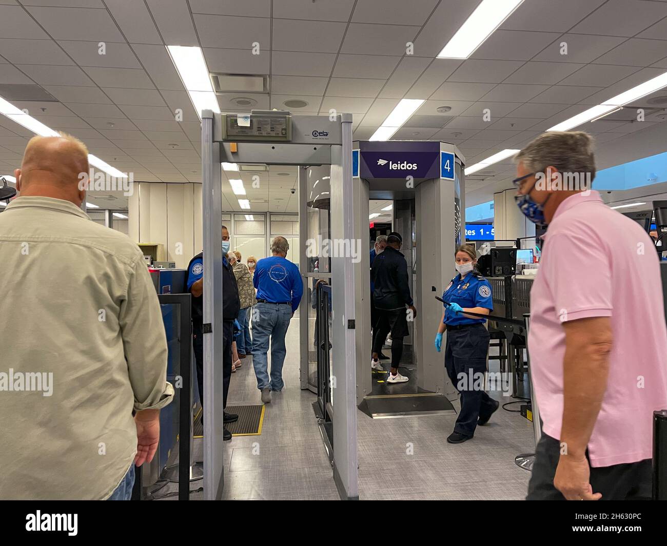 Orlando, FL USA - September 23, 2021:  People walking through the security line at Orlando International Airport MCO. Stock Photo