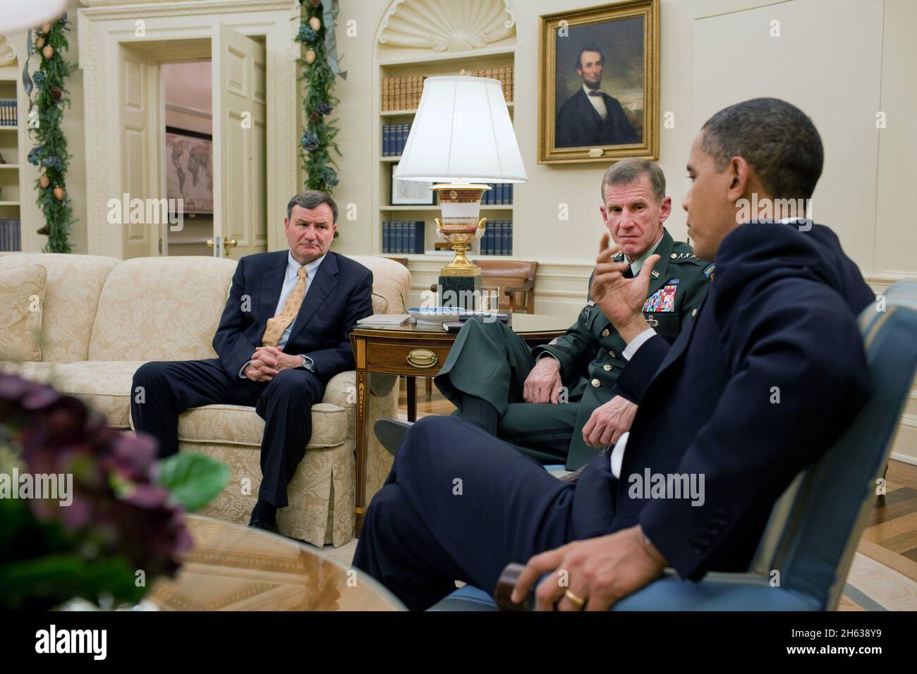 President Barack Obama meets with United States Ambassador to Afghanistan Karl Eikenberry, left, and General Stanley McChrystal, Commander, International Security Assistance Force, in the Oval Office, Dec. 7, 2009. Stock Photo