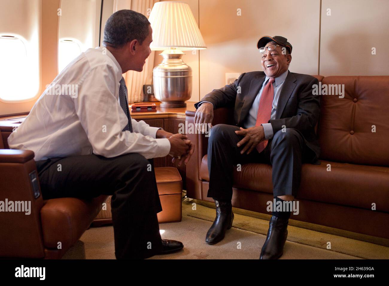 President Barack Obama talks baseball great Willie Mays aboard Air Force One en route to the MLB All-Star Game in St. Louis,  July 14, 2009 Stock Photo