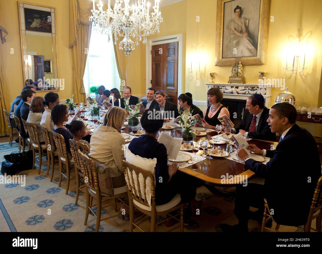 President Obama hosts a traditional Sedar dinner in the Old Family Dining Room of the White House on Thursday night, April 9, 2009. Some friends and White House employees and their families joined the Obama family. Stock Photo