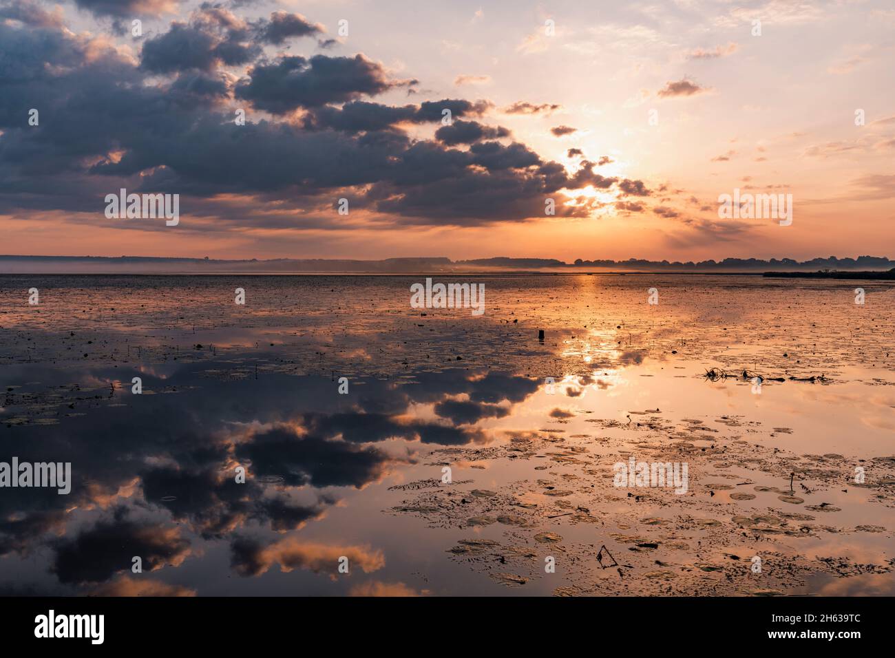 Cloudy sky reflected in water hi-res stock photography and images - Alamy