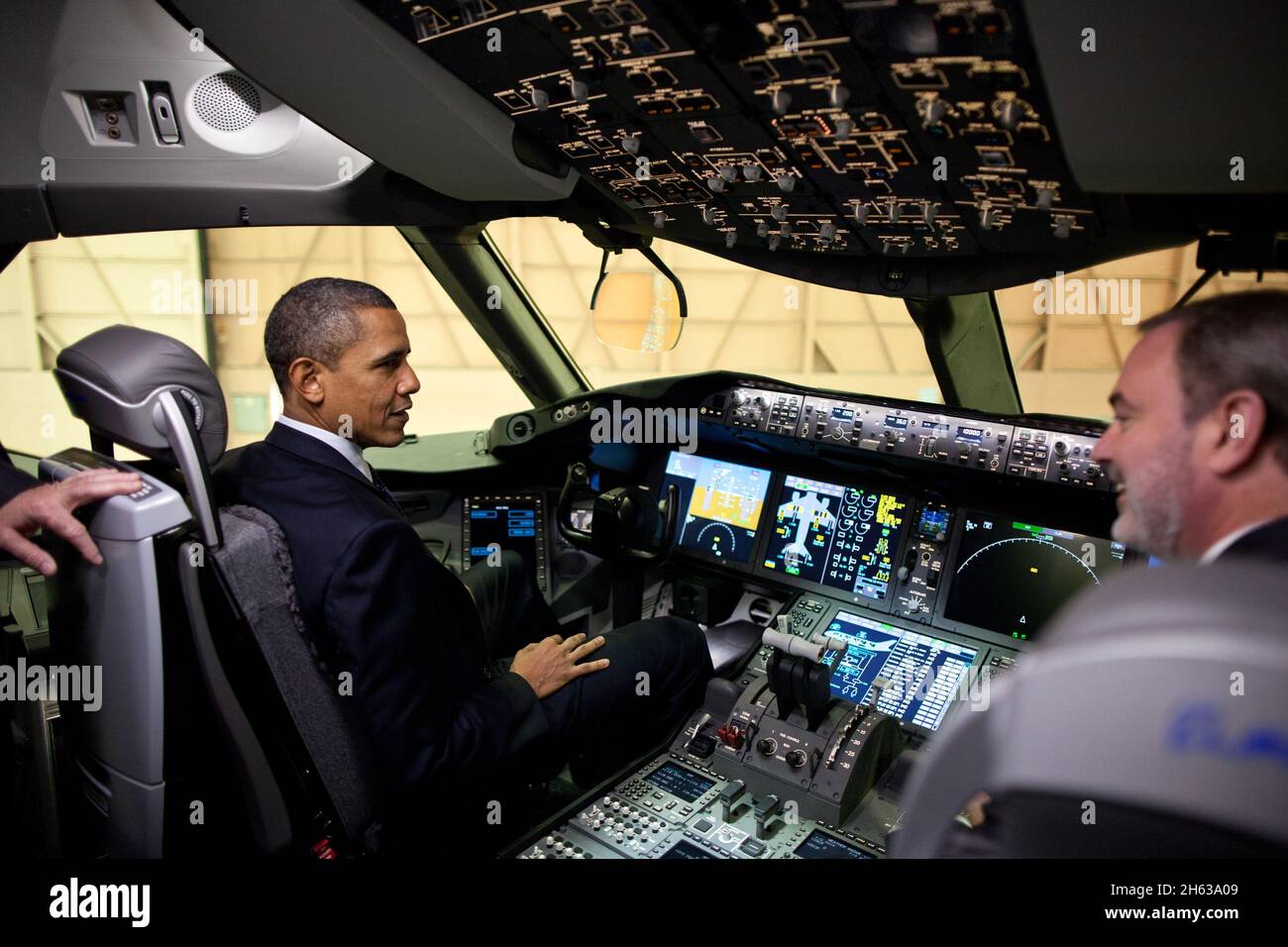 President Barack Obama sits in the cockpit of a 767 during his tour of the Boeing Plant production facility in Everett, Wash., Feb. 17, 2012. Stock Photo