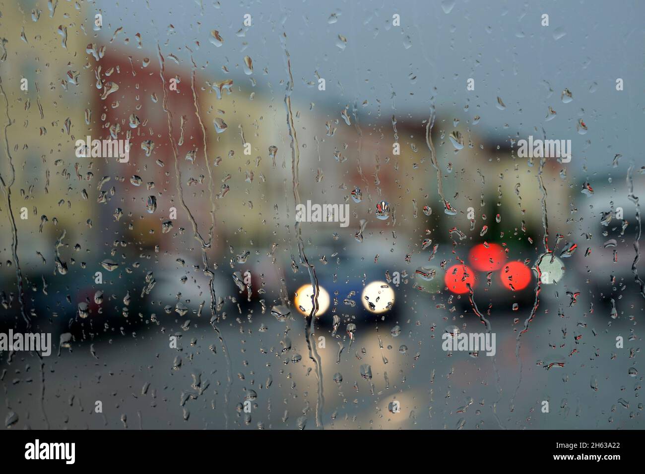 germany,bavaria,upper bavaria,neuötting,rainy weather,window pane,raindrops,traffic,unclear Stock Photo