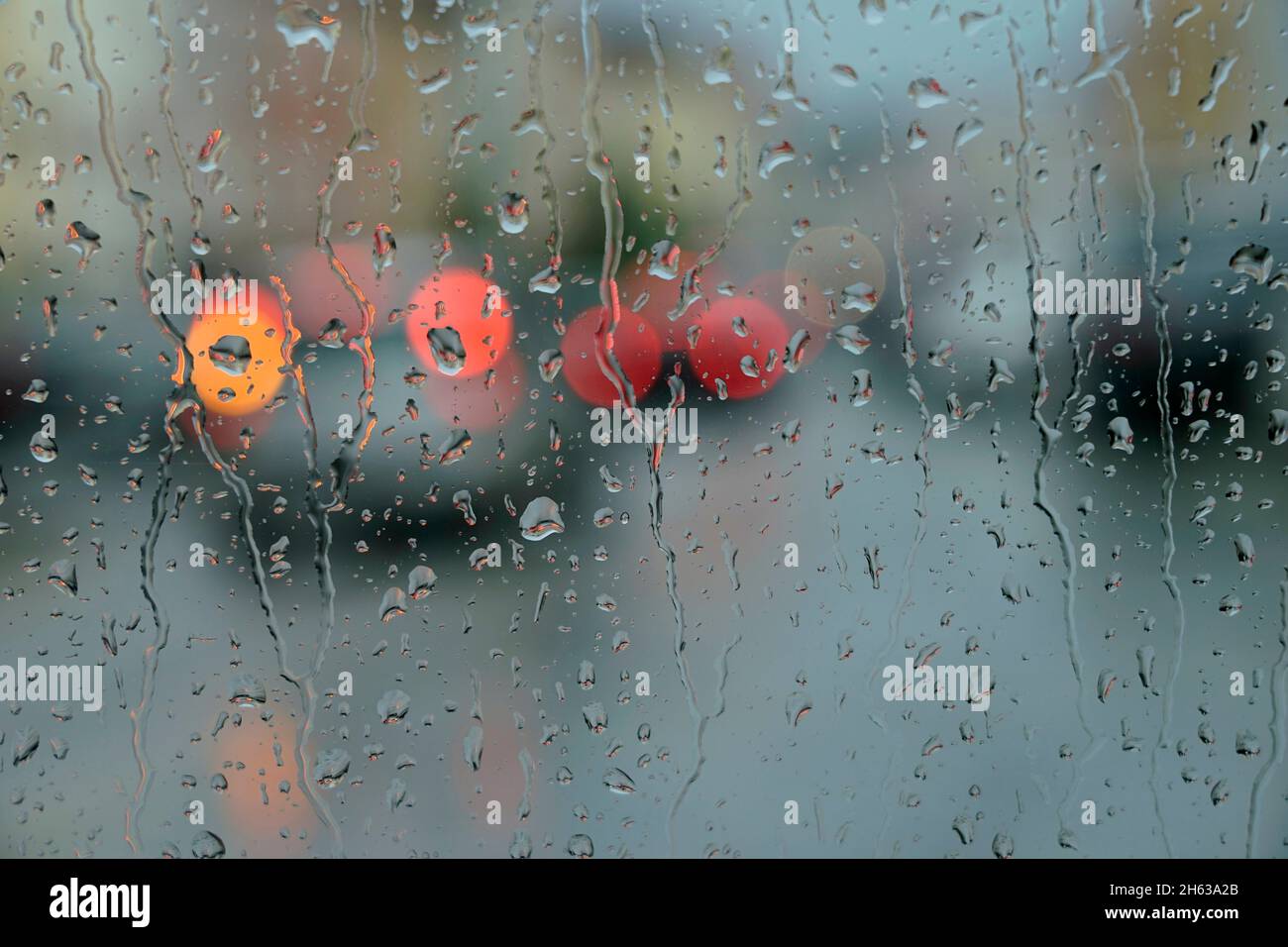 germany,bavaria,upper bavaria,neuötting,rainy weather,window pane,raindrops,traffic,town square,unclear Stock Photo