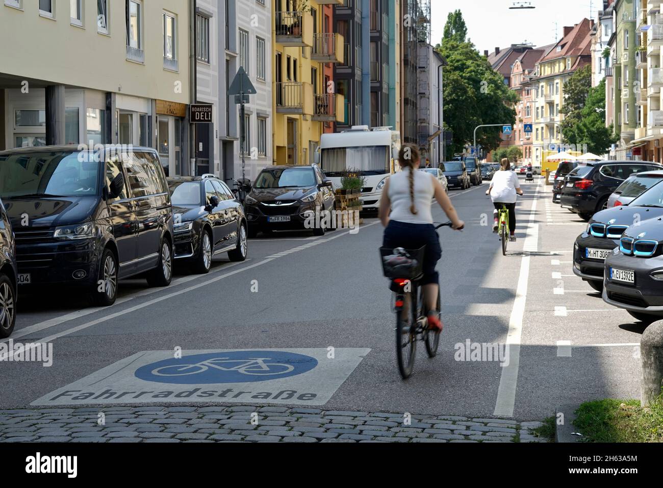 germany,bavaria,munich,munich-schwabing,residential area,bicycle road,cyclists,floor marking Stock Photo