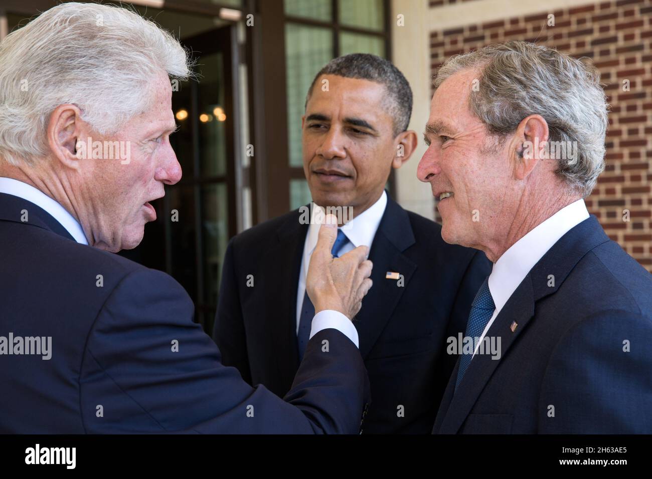 President Barack Obama talks with former Presidents Bill Clinton and George W. Bush before a luncheon at the George W. Bush Presidential Library and Museum on the campus of Southern Methodist University in Dallas, Texas, April 25, 2013. Stock Photo