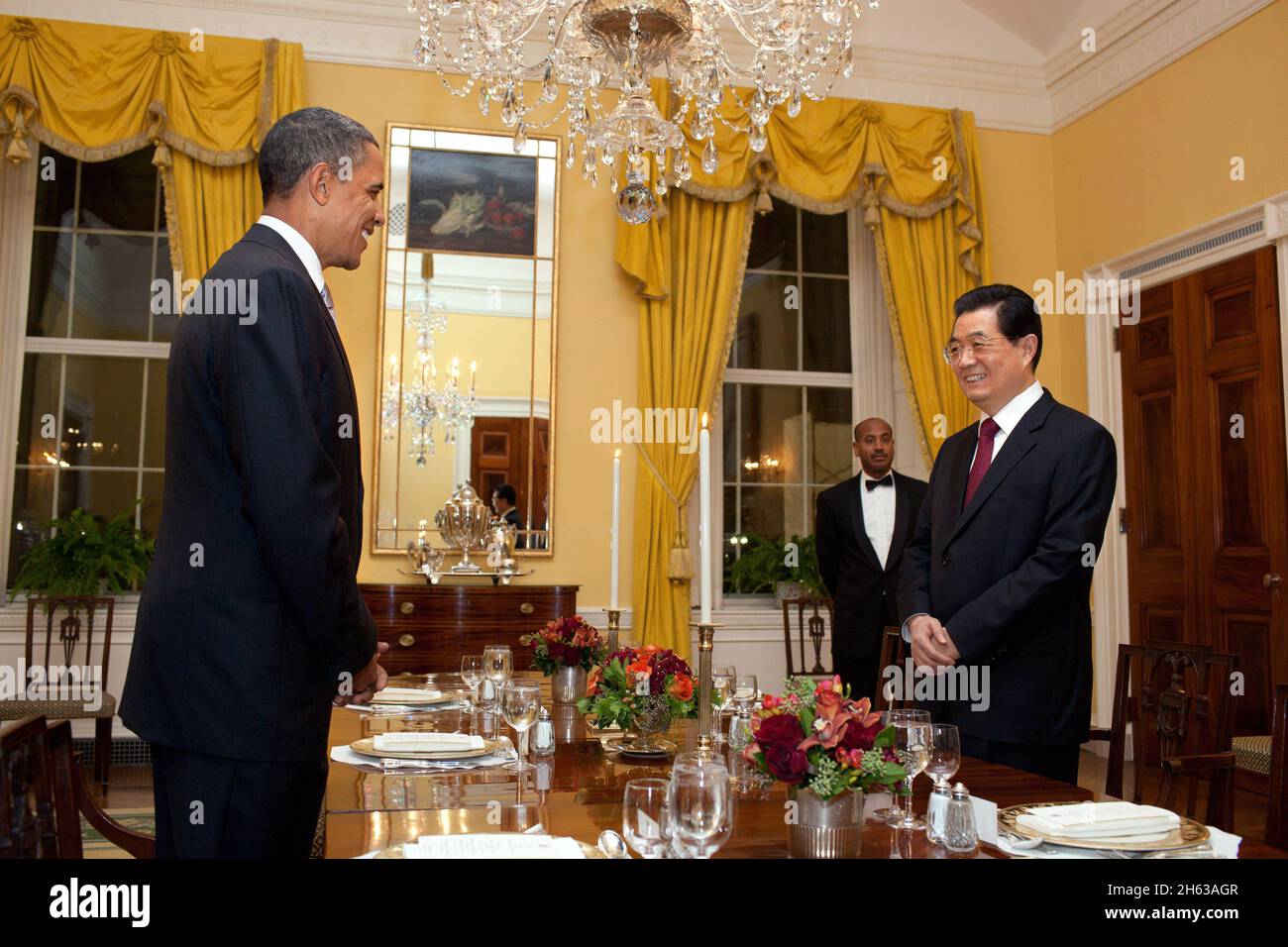President Barack Obama and President Hu Jintao of China begin their working dinner in the Old Family Dining Room of the White House, Jan. 18, 2011. Stock Photo