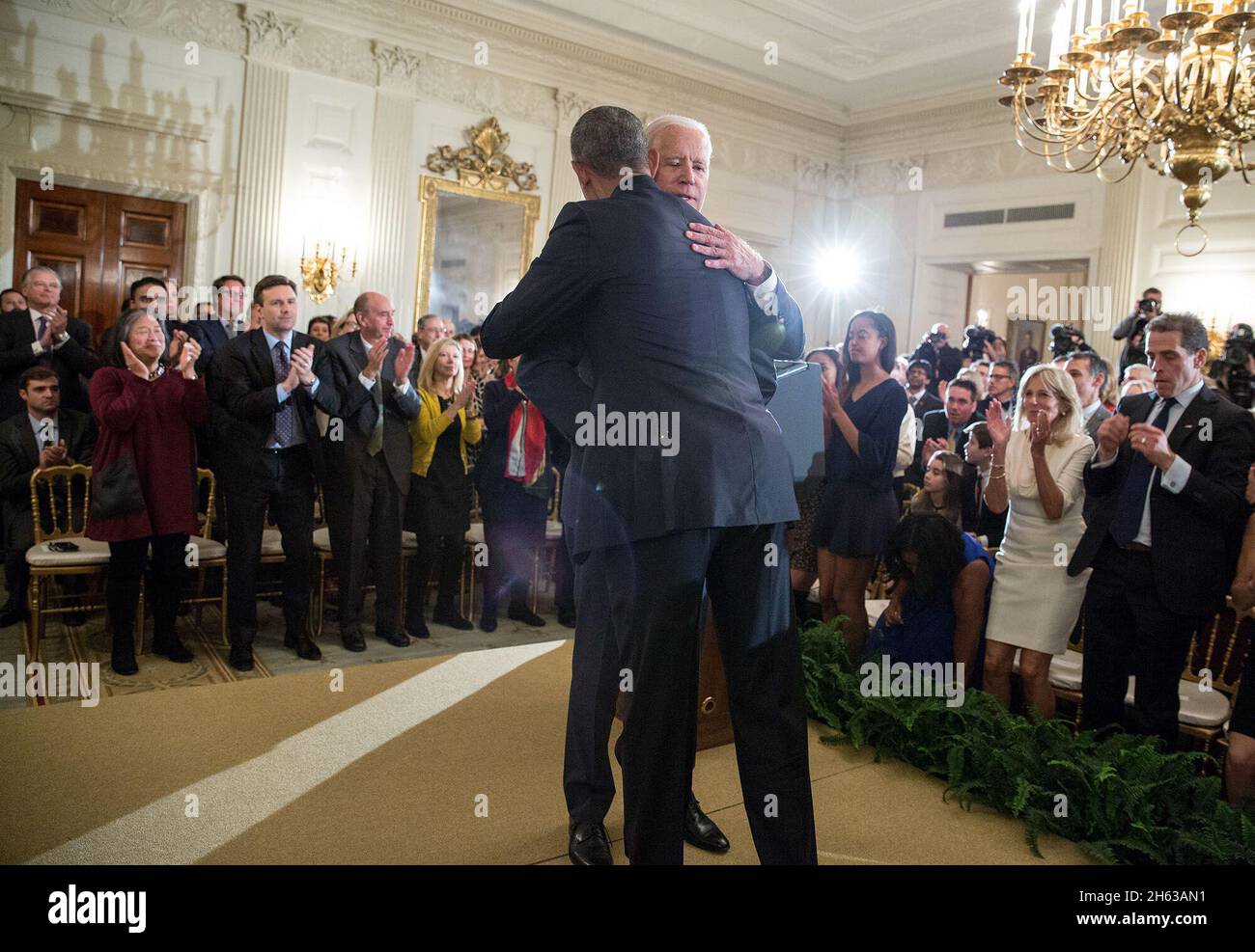 Vice President Joe Biden hugs President Barack Obama after being awarded the Presidential Medal of Freedom with Distinction during a tribute in the State Dining Room of the White House, Jan. 12, 2017. Stock Photo