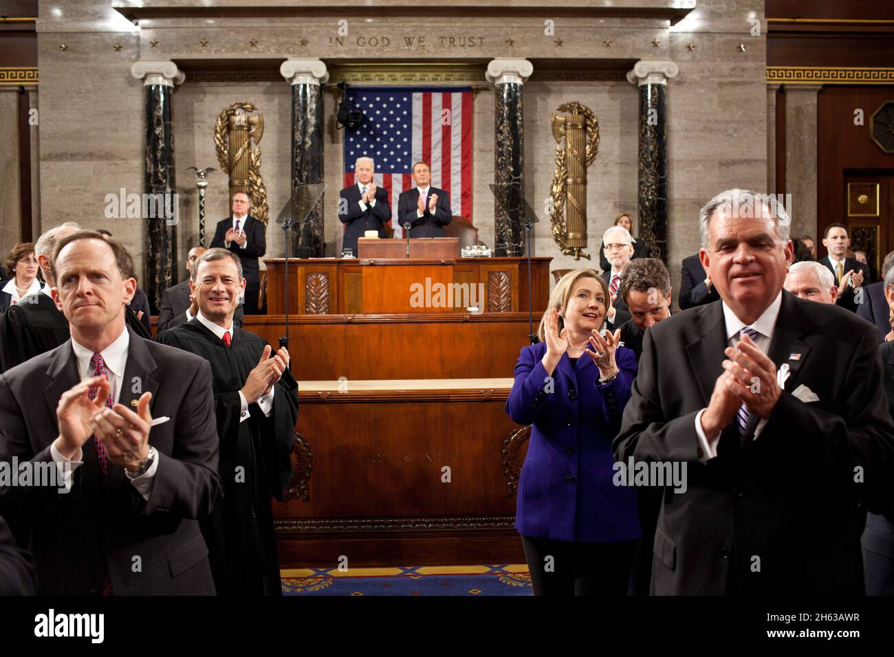 From left: Sen. Patrick Toomey, R-Pa., Supreme Court Chief Justice John Roberts, Secretary of State Hillary Rodham Clinton, Treasury Secretary Timothy Geithner, and Transportation Secretary Ray LaHood applaud as President Barack Obama enters the House Chamber to deliver his State of the Union address at the U.S. Capitol in Washington, D.C., Jan. 25, 2011. Stock Photo