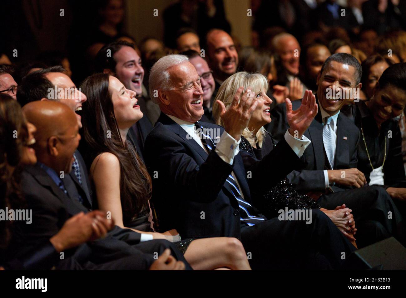 Vice President Joe Biden, joined by daughter Ashley Biden, left, wife Dr. Jill Biden, President Barack Obama and First Lady Michelle Obama, react to a joke made by performing artist Jamie Foxx during ÒThe Motown Sound: In Performance at the White House,Ó a concert celebrating Black History Month and the legacy of Motown Records, in the East Room of the White House, Feb. 24, 2011. Stock Photo