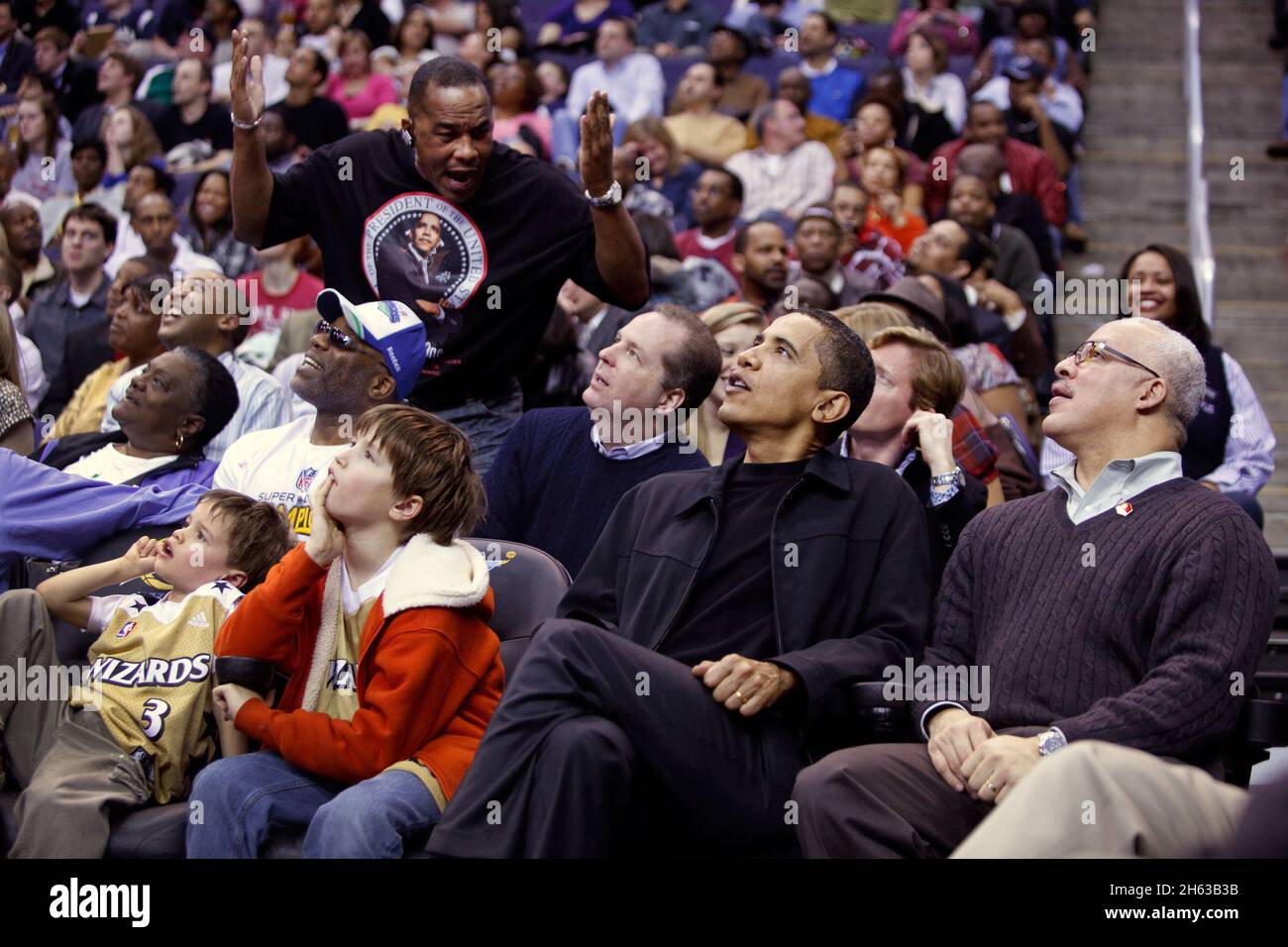 President Barack Obama attends a Washington Wizards vs Chicago Bulls basketball game at the Verizon Center, Washington, D.C 2/27/09 Stock Photo