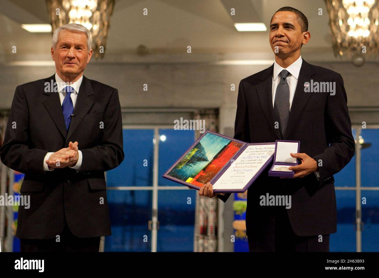Nobel Committee Chairman Thorbjorn Jagland presents President Barack Obama with the Nobel Prize medal and diploma during the Nobel Peace Prize ceremony in Raadhuset Main Hall at Oslo City Hall in Oslo, Norway, Dec. 10, 2009. Stock Photo