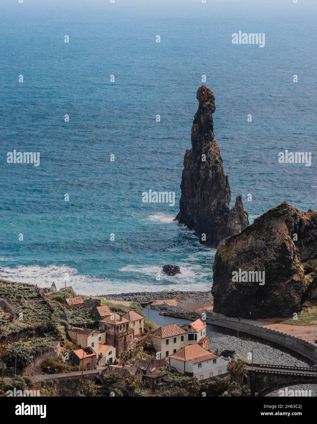 bizarre rock formation on madeira island. settlement in the foreground. Stock Photo