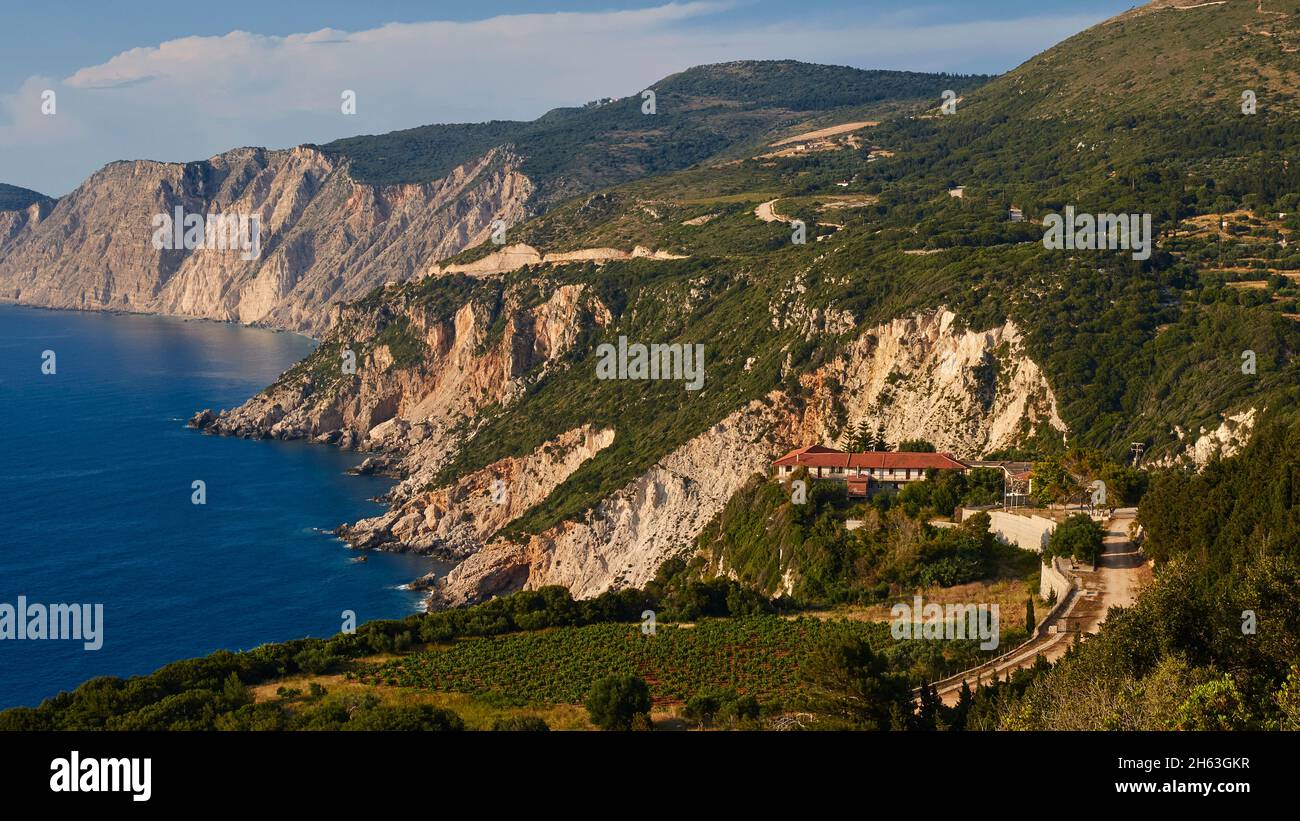 greece,greek islands,ionian islands,kefalonia,paliki peninsula,west coast,evening light,kipoureon monastery,sunset,sailing boat,full moon,rocky coast,kipoureon monastery with a red roof is lonely above the rocky coast in the landscape,in the background even more rugged,steep rocky coast sections Stock Photo
