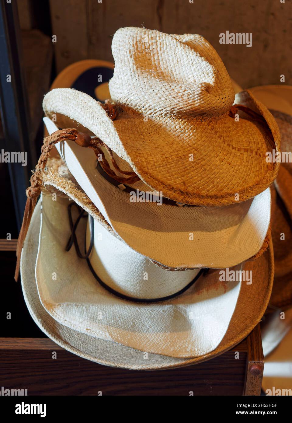 3 stocked western hats,american west,dude ranch,stacked white cowboy hats,usa,wyoming,bighorn mountains,eaton ranch Stock Photo