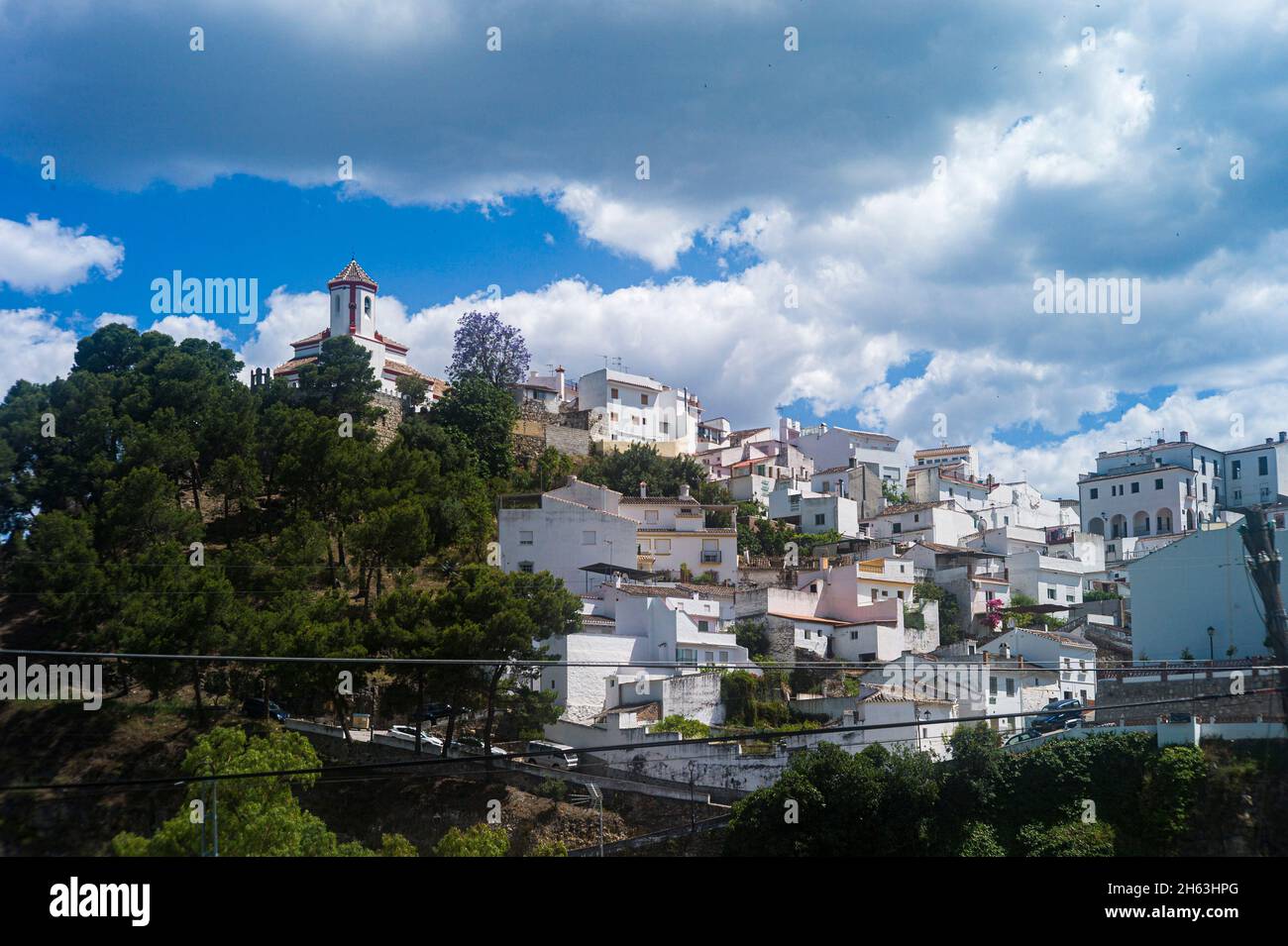 view of the white village with the church at the top,alozaina,malaga province,in the region of the sierra de las nieves national park,andalusia,spain Stock Photo