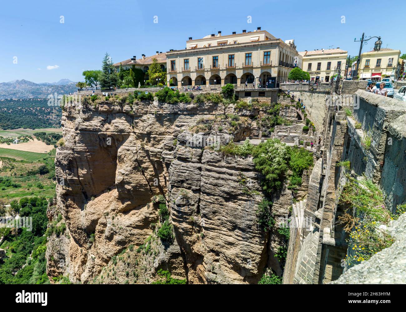 the puente nuevo ('new bridge') span the 120-metre-deep chasm that carries the guadaleva–n river and divides the city of ronda,the el tajo gorge. ronda,provence of malaga,andalusia,spain. (panorama) Stock Photo