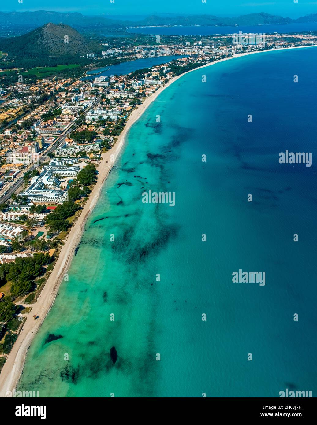 aerial view,alcudia,turquoise blue water on the beach of alcudia,platja d'alcudia,empty beach due to the corona pandemic,aneta (sa),mallorca,balearic island,balearic islands,baleares,spain Stock Photo