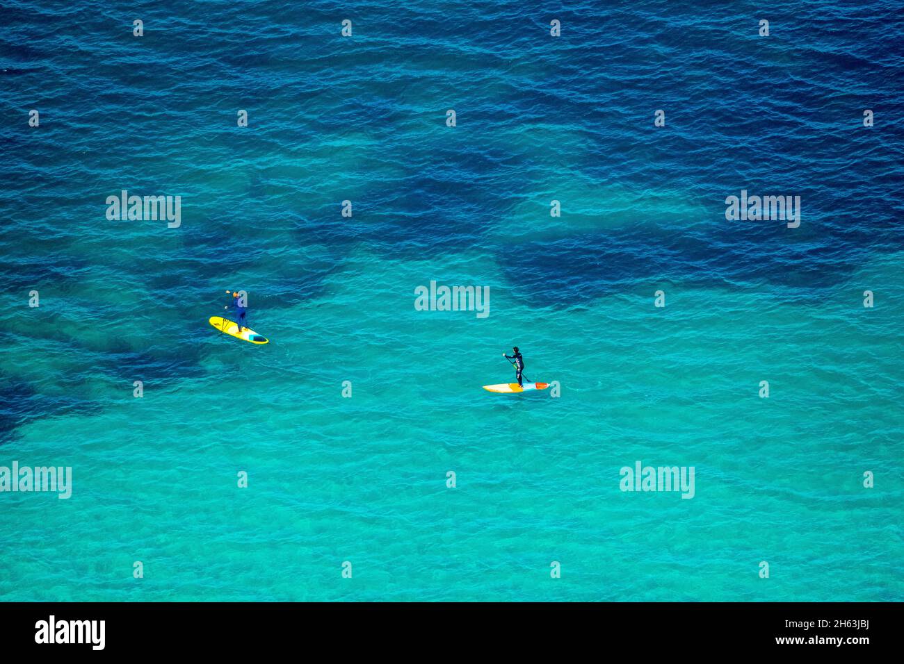 aerial view,standup paddler in the turquoise blue water,sandy beach of can picafort,illes balears,can picafort,mallorca,balearic island,balearic islands,baleares,spain Stock Photo