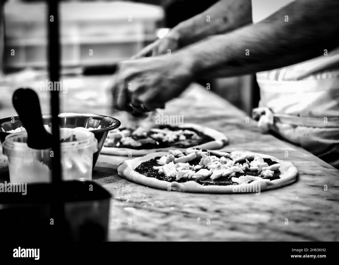 A chef making pizza bound for the wood fired oven at a pizzeria in Kamakura, Japan. Stock Photo