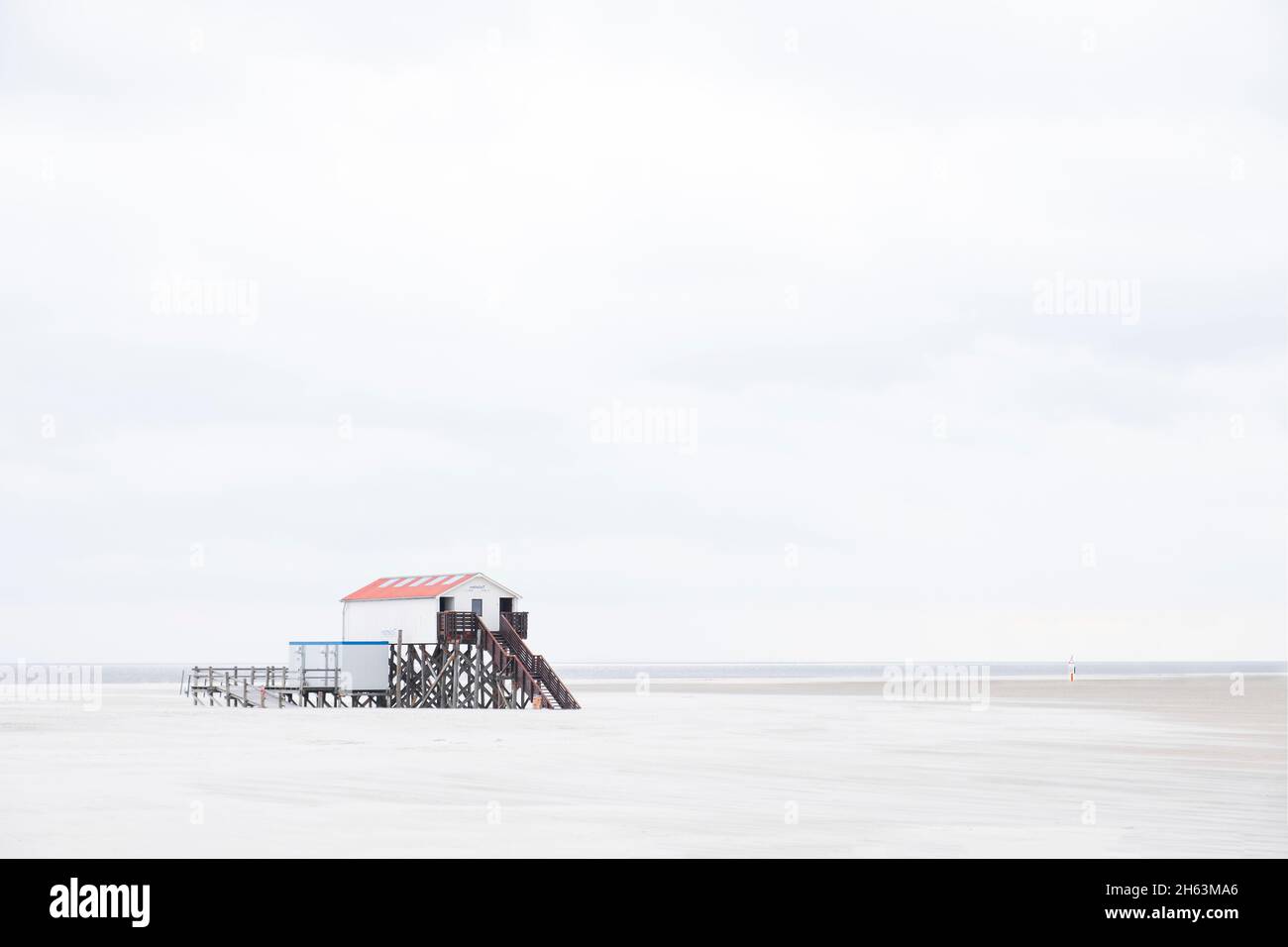 stilt house on the beach of sankt peter ording Stock Photo Alamy