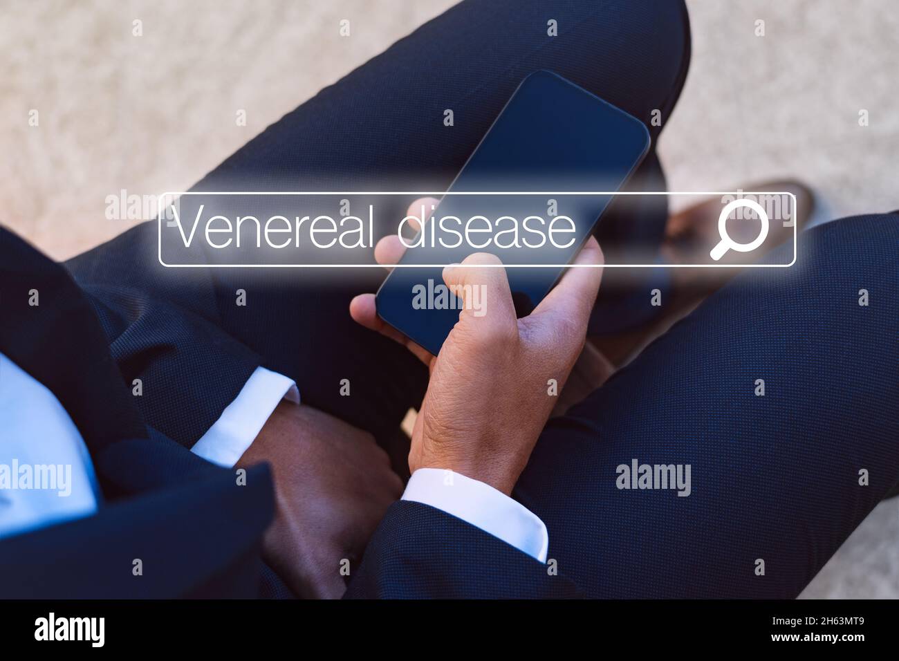 Man with urology problems searching in internet about venereal disease Stock Photo