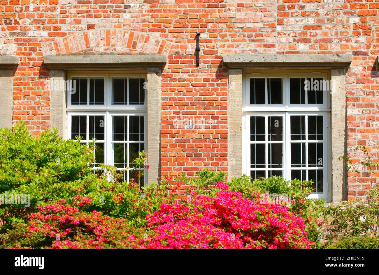window with flowers,medieval moated castle blomendal in bremen-blumenthal,bremen,germany,europe Stock Photo