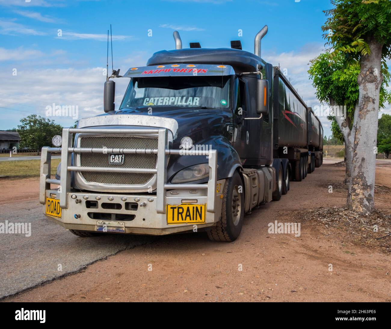 A typical example of the road trains in Australia, Carrying livestock, mining equipment, ore and who knows what else. Stock Photo