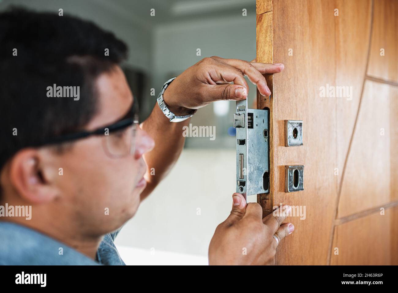 Installing security lock hi-res stock photography and images - Alamy