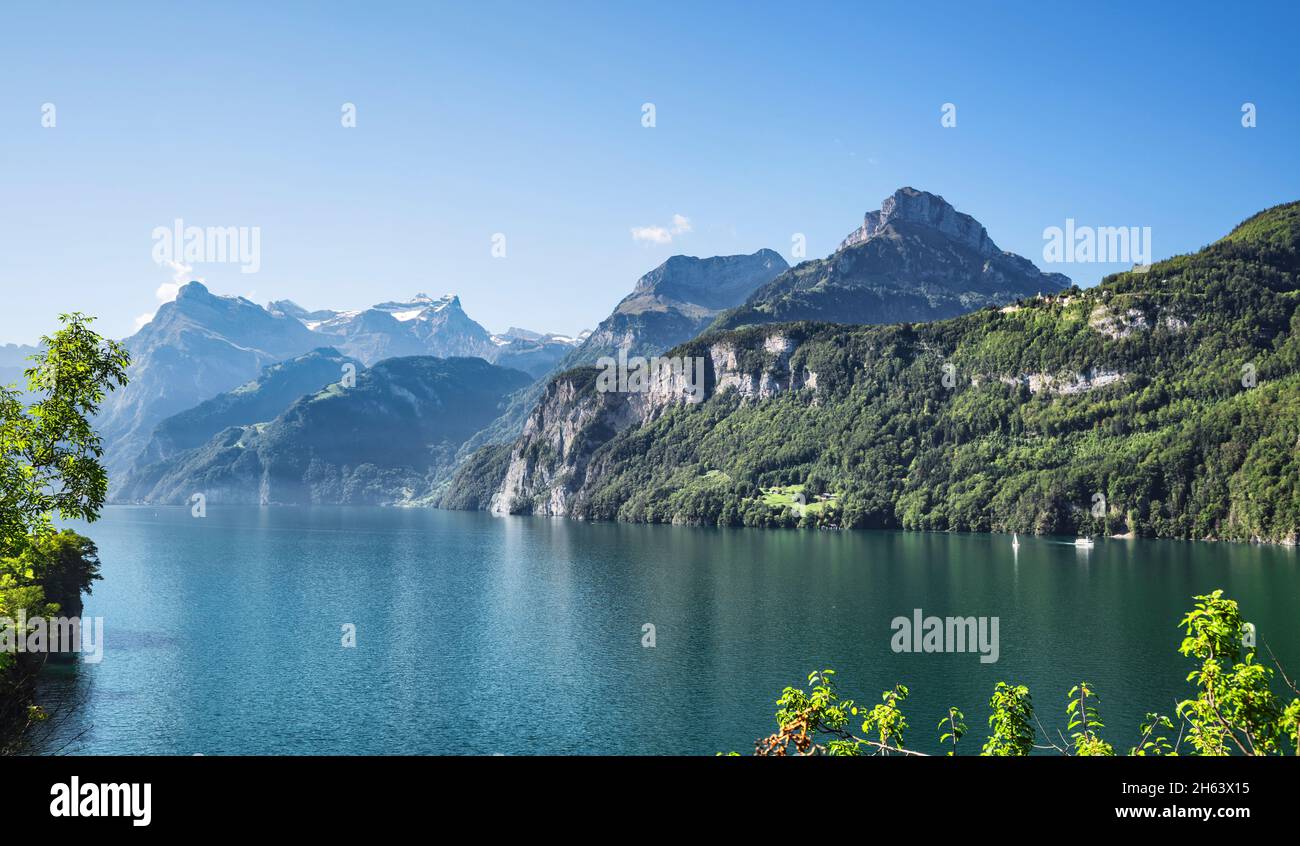Brunen Lake Rocks lake lucerne near brunnen framed by wild rock mountains on a sunny ...