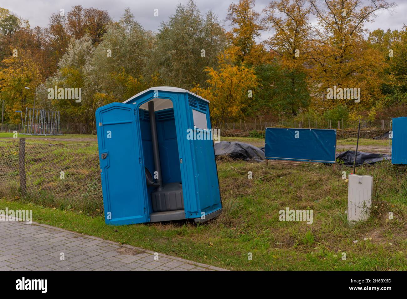 germany,luckenwalde,21 october 2021,storm 'hendrik',almost blown over construction site toilet during the storm Stock Photo
