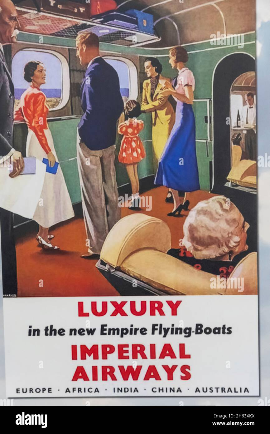 england,southampton,solent sky museum,vintage imperial airways flying-boat poster advertising long distance luxury travel Stock Photo