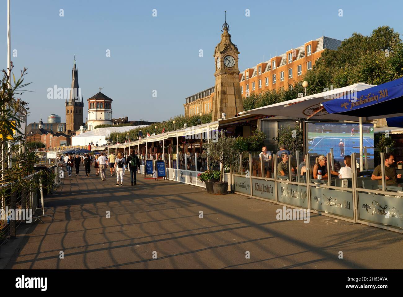 bank of the rhine with the church of st. lambertus,castle tower and level clock in düsseldorf am rhein,düsseldorf,north rhine-westphalia,germany Stock Photo